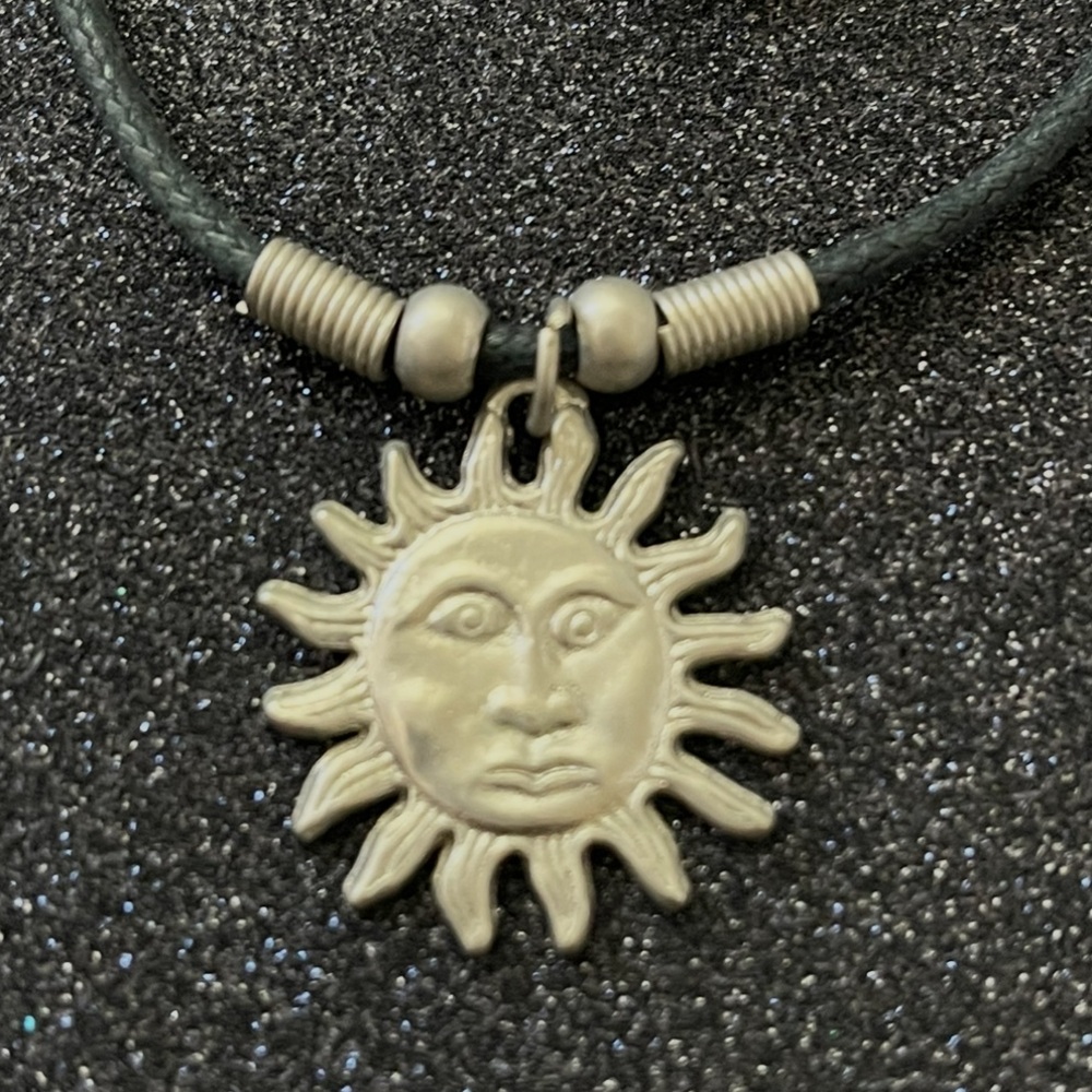 Celestial Sun faced Pendant On A Black Cord Necklace